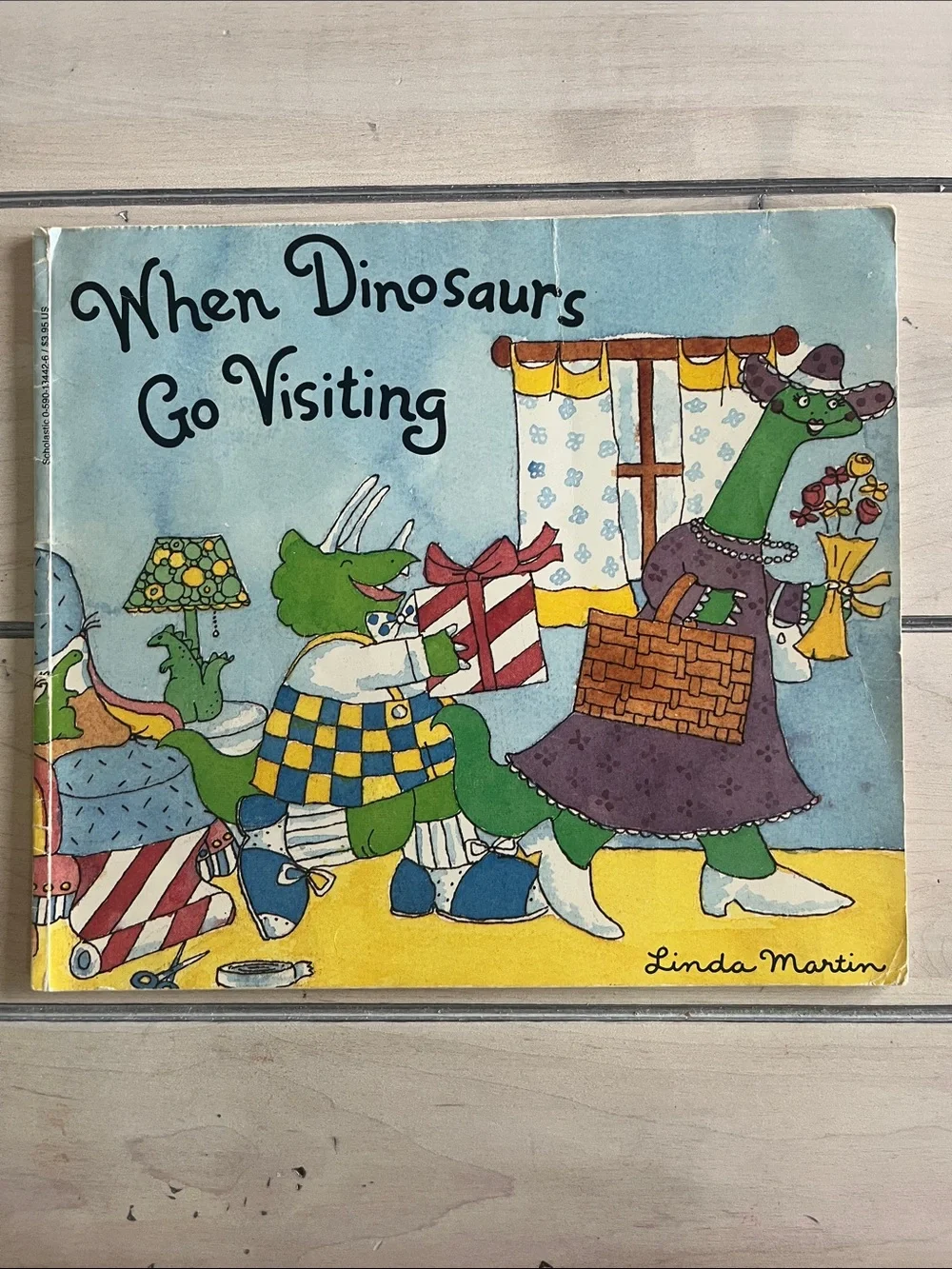 Set of 4 Dinosaur themed books, fiction and non-fiction